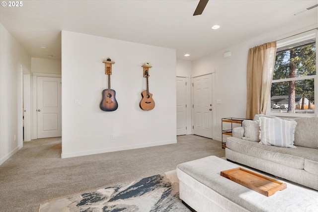 living area with recessed lighting, visible vents, baseboards, and light colored carpet