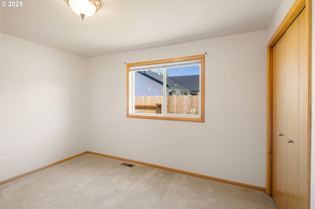 586 Creswood Loop, Creswell, OR 97426 - unfurnished bedroom with light colored carpet, baseboards, and a closet