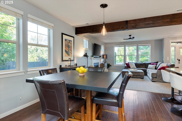10449 SW Denmark St, Wilsonville, OR 97070 - dining space with plenty of natural light, baseboards, beamed ceiling, and dark wood-style flooring