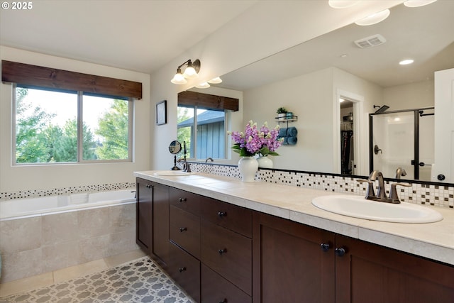 10449 SW Denmark St, Wilsonville, OR 97070 - bathroom with double vanity, a stall shower, tile patterned flooring, a bath, and decorative backsplash