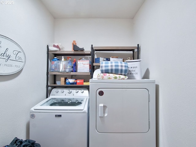 washroom featuring washer and clothes dryer