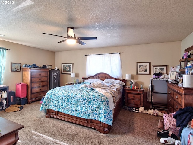 bedroom with a textured ceiling and ceiling fan