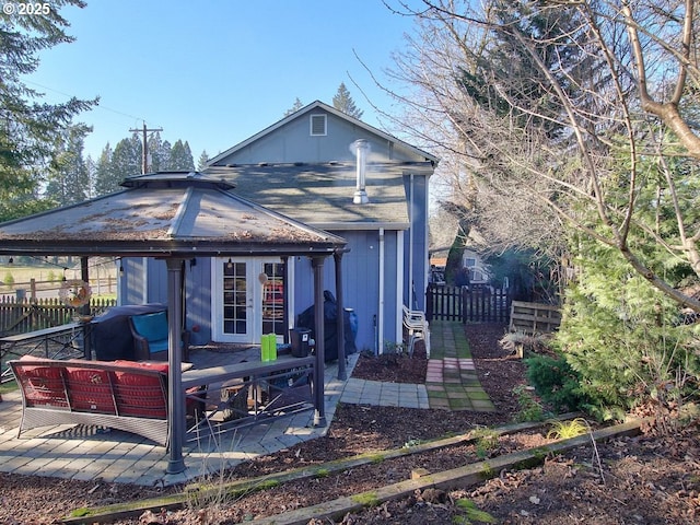 back of house with outdoor lounge area and french doors