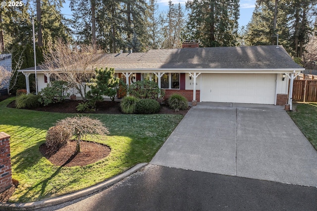 single story home featuring a garage and a front lawn