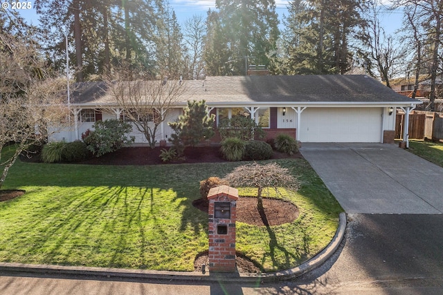 single story home featuring a garage and a front yard