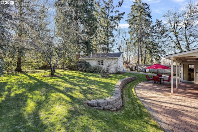 view of yard with a patio and an outdoor structure