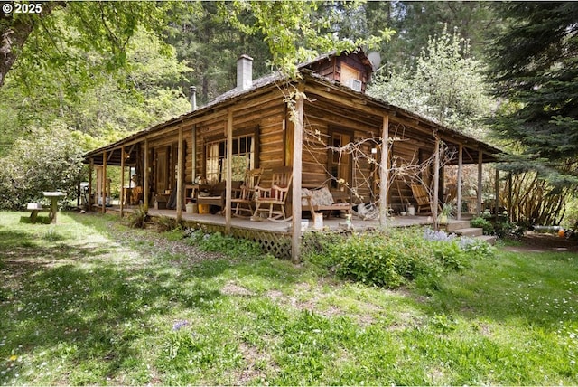 2128 Starveout Creek Rd, Azalea, OR 97410 - view of home's exterior with a chimney, a lawn, and a deck