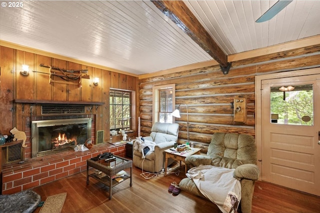 2128 Starveout Creek Rd, Azalea, OR 97410 - living room with log walls, a brick fireplace, hardwood / wood-style floors, beam ceiling, and wood ceiling