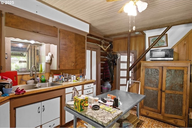 2128 Starveout Creek Rd, Azalea, OR 97410 - kitchen featuring a sink, light countertops, brown cabinets, wooden ceiling, and ceiling fan