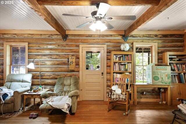 2128 Starveout Creek Rd, Azalea, OR 97410 - sitting room featuring beamed ceiling, a ceiling fan, hardwood / wood-style flooring, rustic walls, and wood ceiling
