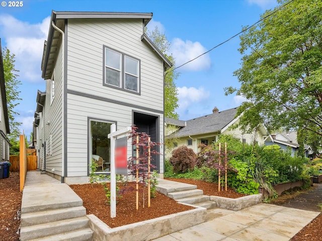 view of front of property with fence