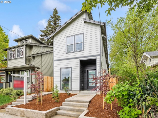 view of front of house with fence