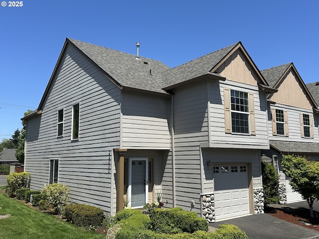 22000 SW Grahams Ferry Rd Unit C, Tualatin, OR 97062 - view of front of property featuring an attached garage, a shingled roof, and driveway