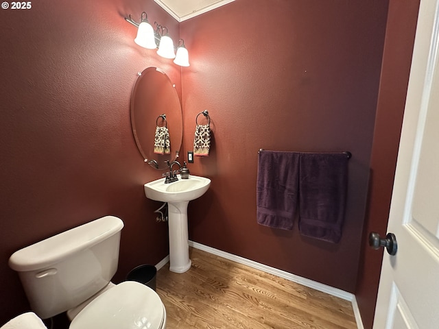 22000 SW Grahams Ferry Rd Unit C, Tualatin, OR 97062 - bathroom with toilet, wood finished floors, a sink, and baseboards