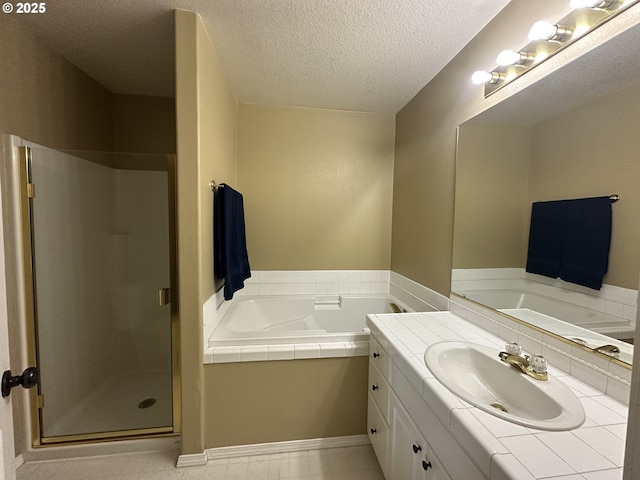 22000 SW Grahams Ferry Rd Unit C, Tualatin, OR 97062 - full bath featuring vanity, a bath, a shower stall, and a textured ceiling