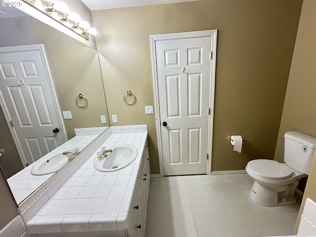 22000 SW Grahams Ferry Rd Unit C, Tualatin, OR 97062 - bathroom with toilet, vanity, and baseboards
