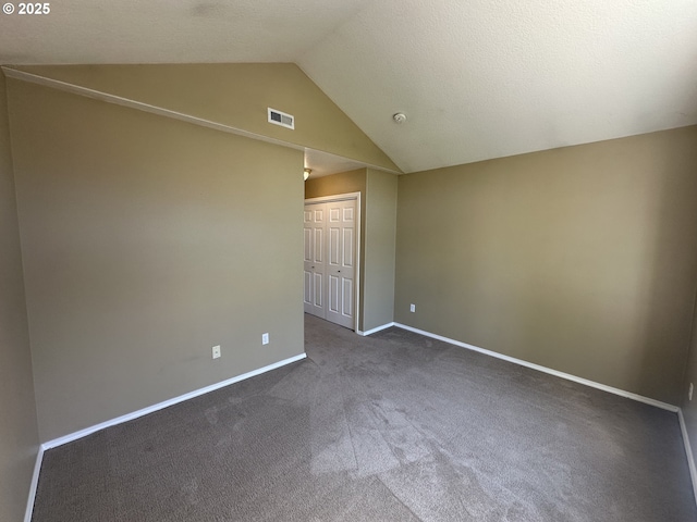 22000 SW Grahams Ferry Rd Unit C, Tualatin, OR 97062 - spare room with vaulted ceiling, dark carpet, baseboards, and a smoke detector