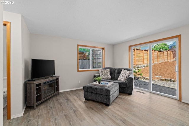 sitting room featuring wood finished floors and baseboards