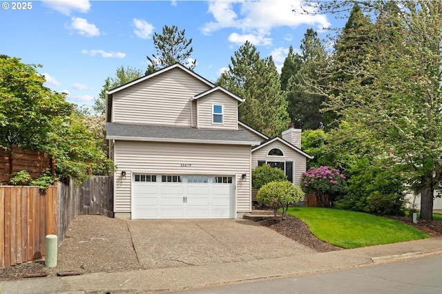 traditional-style home with driveway, a garage, and a chimney