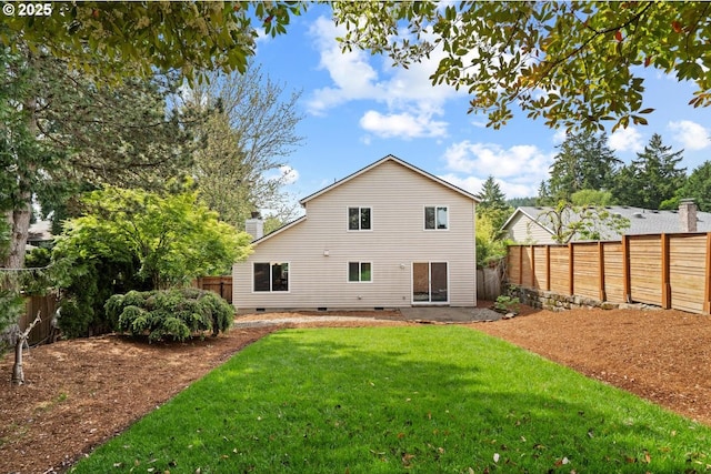 rear view of house with crawl space and a chimney