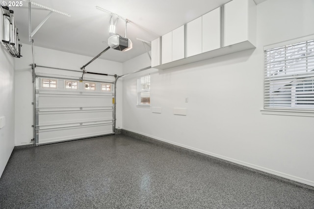 30326 SW Ruth St Unit 56, Wilsonville, OR 97070 - garage with a garage door opener and baseboards