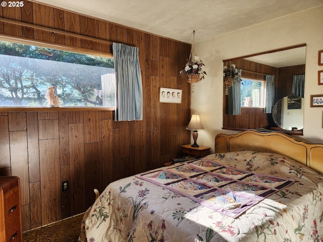 bedroom with wood walls