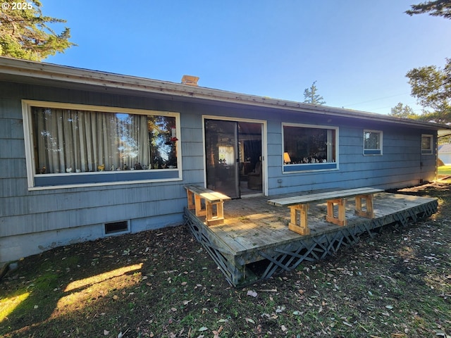 back of house featuring a deck