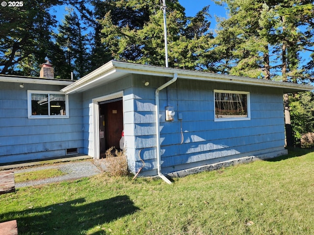 view of outdoor structure with a yard