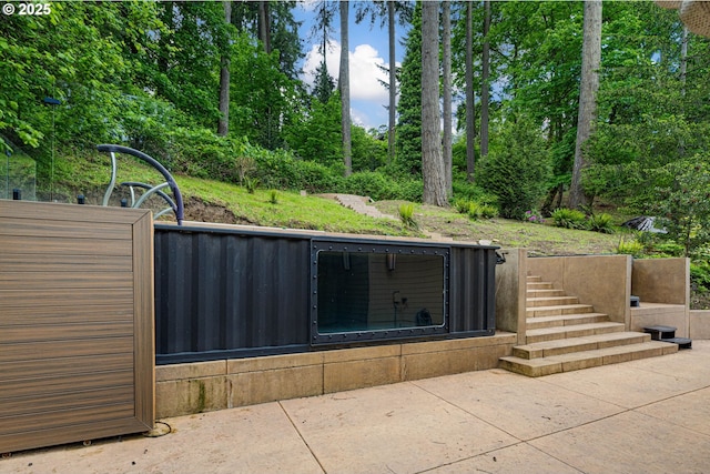 view of patio / terrace featuring stairs