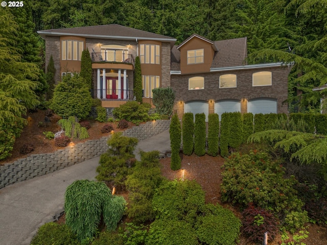 12712 SE 137th Dr, Happy Valley, OR 97086 - view of front of house featuring a balcony and a view of trees