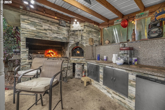 12712 SE 137th Dr, Happy Valley, OR 97086 - view of patio with a warm lit fireplace and an outdoor kitchen