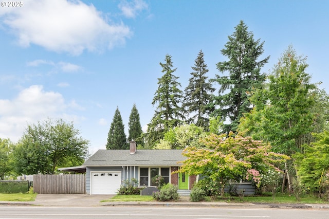 960 E Main St, Hillsboro, OR 97123 - view of front of home with a garage, driveway, and a chimney
