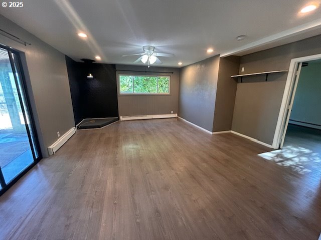 960 E Main St, Hillsboro, OR 97123 - unfurnished bedroom with a baseboard radiator, baseboard heating, wood finished floors, recessed lighting, and access to outside