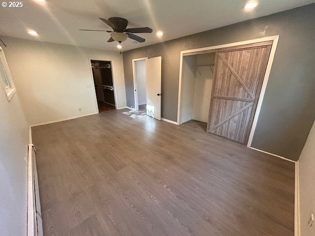 960 E Main St, Hillsboro, OR 97123 - unfurnished bedroom with wood finished floors, multiple closets, recessed lighting, and ceiling fan
