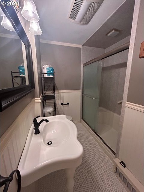 960 E Main St, Hillsboro, OR 97123 - full bath with wainscoting, a stall shower, ornamental molding, and tile patterned flooring