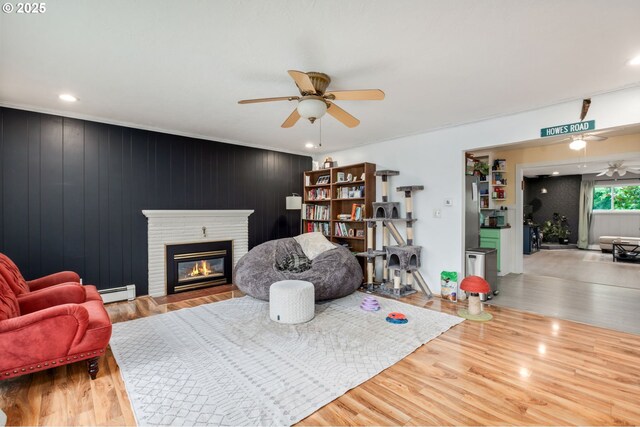 960 E Main St, Hillsboro, OR 97123 - living room with ceiling fan, wood finished floors, a brick fireplace, baseboard heating, and recessed lighting