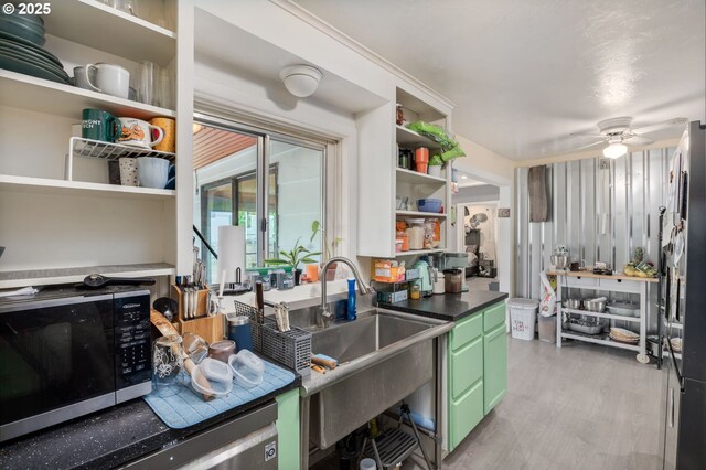 960 E Main St, Hillsboro, OR 97123 - kitchen featuring green cabinets, open shelves, light wood finished floors, ceiling fan, and stainless steel fridge