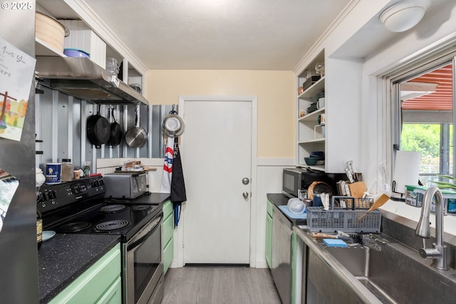 960 E Main St, Hillsboro, OR 97123 - kitchen with electric range, open shelves, light wood finished floors, dark countertops, and wainscoting