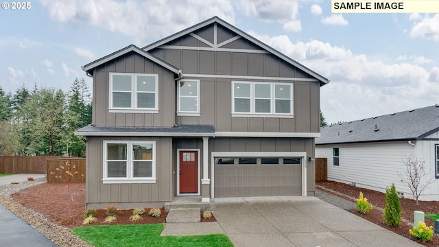 360 NW 29th Way, Battle Ground, WA 98604 - view of front of house with board and batten siding, a garage, driveway, and a shingled roof