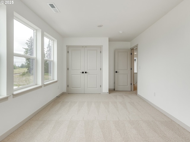 360 NW 29th Way, Battle Ground, WA 98604 - unfurnished bedroom with light carpet, baseboards, and a closet