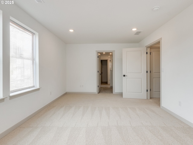 360 NW 29th Way, Battle Ground, WA 98604 - unfurnished bedroom featuring multiple windows, light colored carpet, recessed lighting, and baseboards
