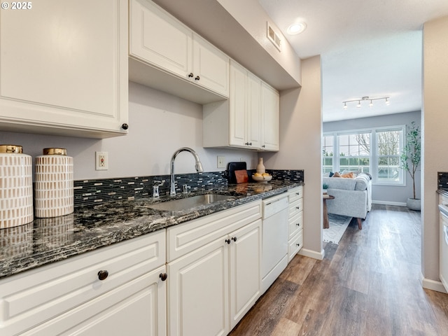 2001 E Evergreen Blvd, Vancouver, WA 98661 - kitchen with dishwasher, a sink, wood finished floors, baseboards, and white cabinetry