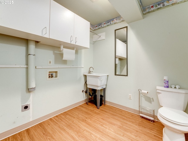 2001 E Evergreen Blvd, Vancouver, WA 98661 - laundry room with light wood-style flooring, hookup for a washing machine, hookup for an electric dryer, and baseboards