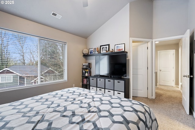 bedroom with carpet, visible vents, high vaulted ceiling, and ceiling fan