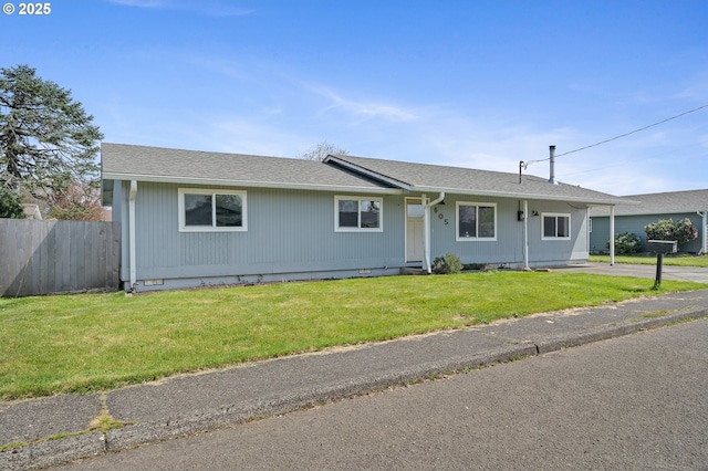 single story home featuring fence, a front lawn, and roof with shingles