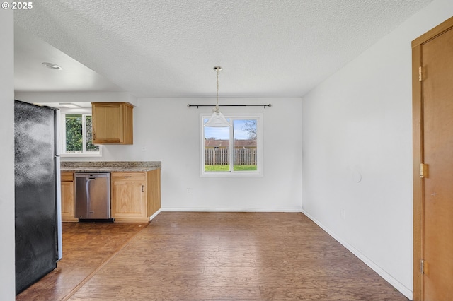 kitchen with dark wood finished floors, decorative light fixtures, baseboards, a textured ceiling, and appliances with stainless steel finishes