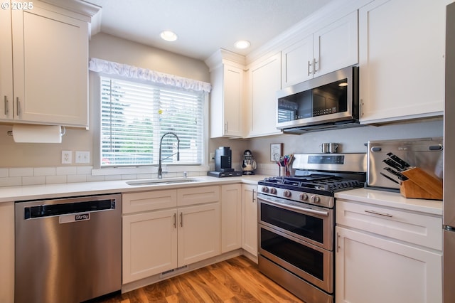 10100 NE 65th Cir, Vancouver, WA 98662 - kitchen featuring stainless steel appliances, white cabinets, light countertops, and recessed lighting