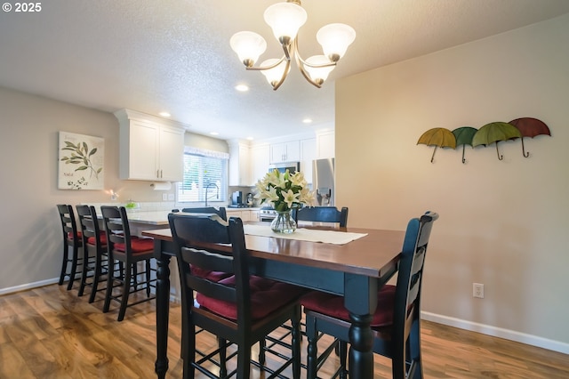 10100 NE 65th Cir, Vancouver, WA 98662 - dining area featuring a chandelier, wood finished floors, and recessed lighting