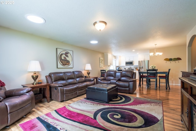 10100 NE 65th Cir, Vancouver, WA 98662 - living room featuring a chandelier, light wood-style flooring, and recessed lighting