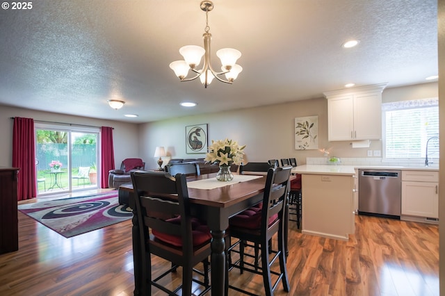 10100 NE 65th Cir, Vancouver, WA 98662 - dining room with wood finished floors, a chandelier, recessed lighting, and a textured ceiling